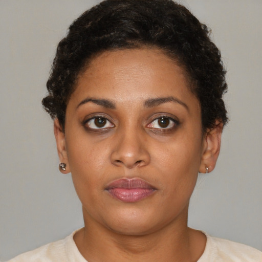 Neutral latino young-adult female with short  brown hair and brown eyes