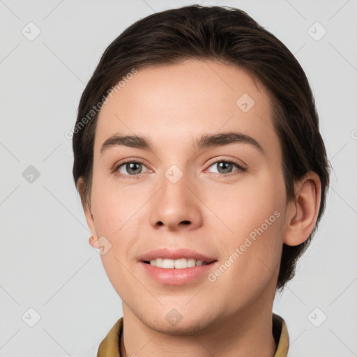 Joyful white young-adult female with short  brown hair and grey eyes