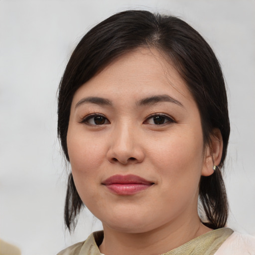 Joyful white young-adult female with medium  brown hair and brown eyes