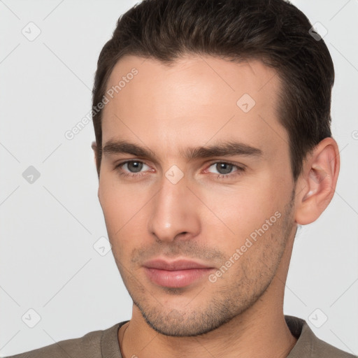 Neutral white young-adult male with short  brown hair and brown eyes