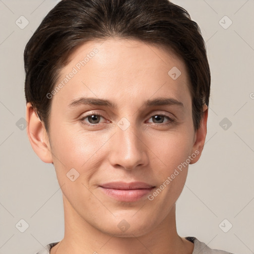 Joyful white young-adult female with short  brown hair and brown eyes