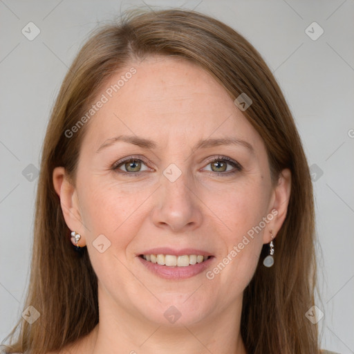 Joyful white adult female with long  brown hair and grey eyes