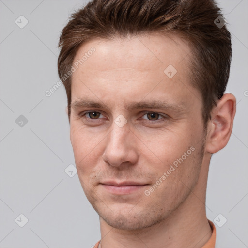 Joyful white adult male with short  brown hair and brown eyes