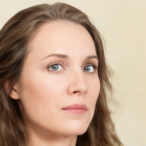 Neutral white young-adult female with long  brown hair and green eyes