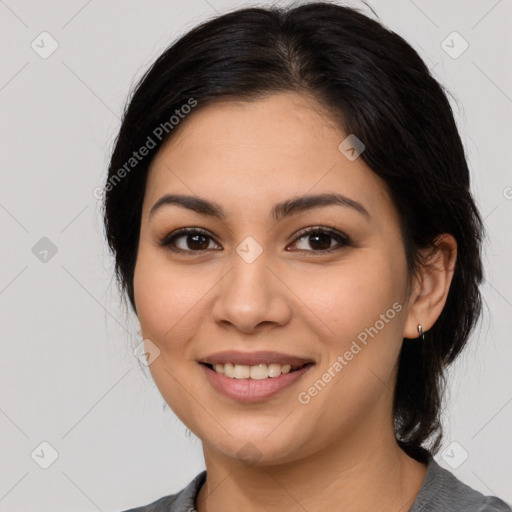 Joyful latino young-adult female with medium  black hair and brown eyes