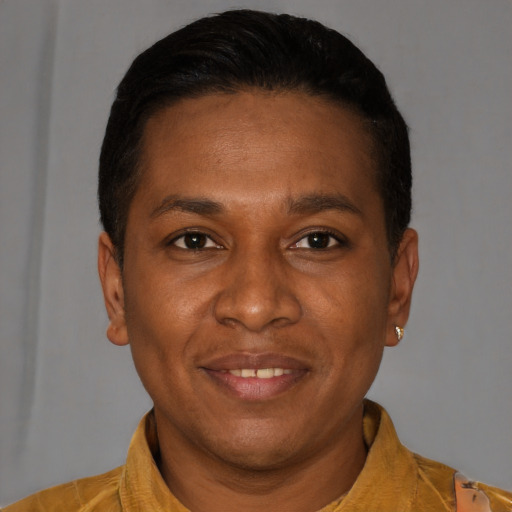 Joyful latino adult male with short  black hair and brown eyes