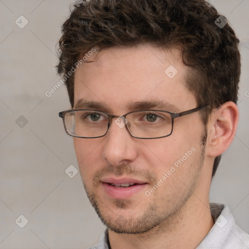 Joyful white adult male with short  brown hair and grey eyes