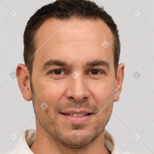 Joyful white adult male with short  brown hair and brown eyes