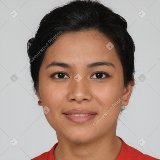 Joyful latino young-adult female with short  black hair and brown eyes