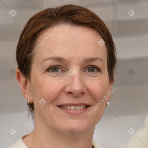 Joyful white adult female with medium  brown hair and grey eyes