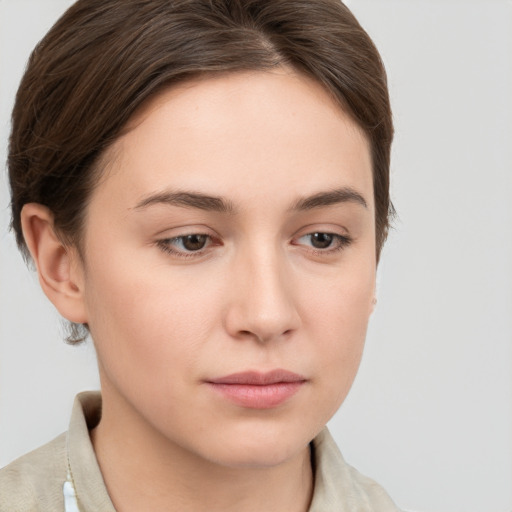 Neutral white young-adult female with short  brown hair and brown eyes