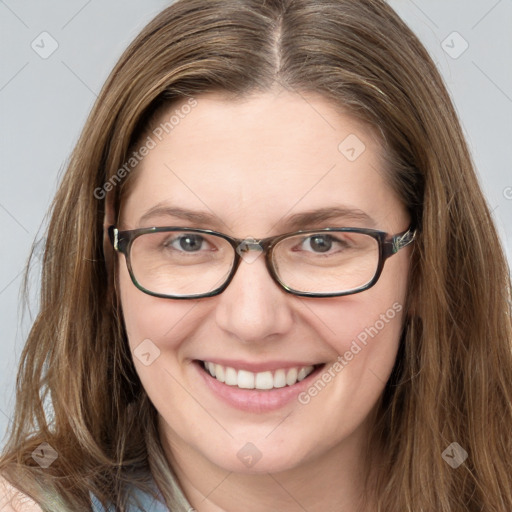 Joyful white young-adult female with long  brown hair and green eyes