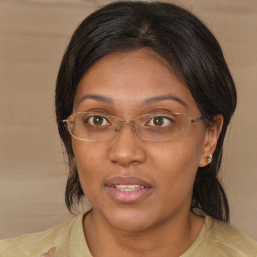 Joyful asian adult female with medium  brown hair and brown eyes