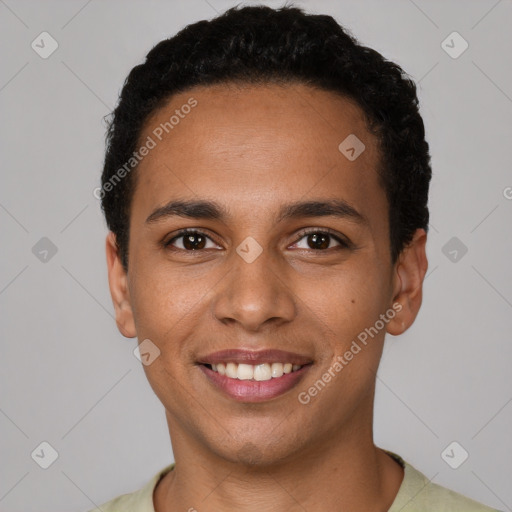 Joyful latino young-adult male with short  brown hair and brown eyes