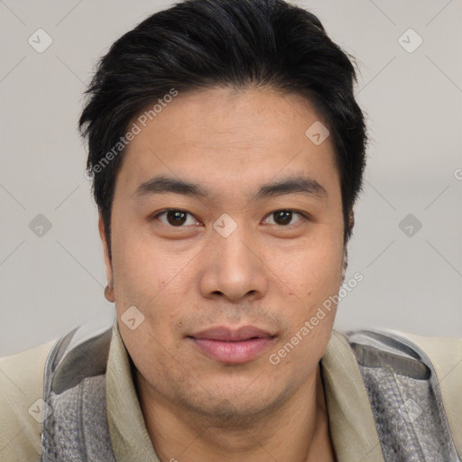 Joyful asian young-adult male with short  black hair and brown eyes