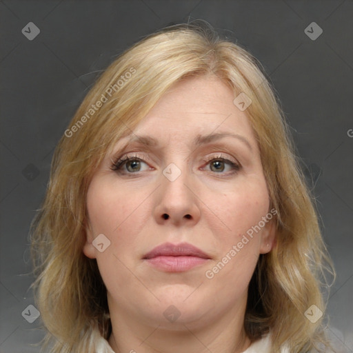 Joyful white adult female with medium  brown hair and blue eyes