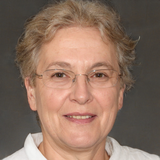 Joyful white middle-aged female with short  brown hair and blue eyes