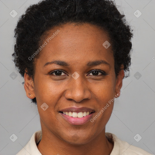 Joyful black young-adult female with short  black hair and brown eyes