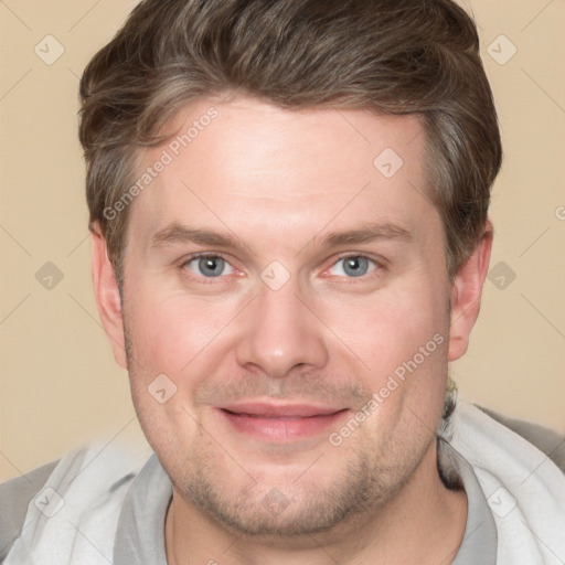 Joyful white adult male with short  brown hair and grey eyes