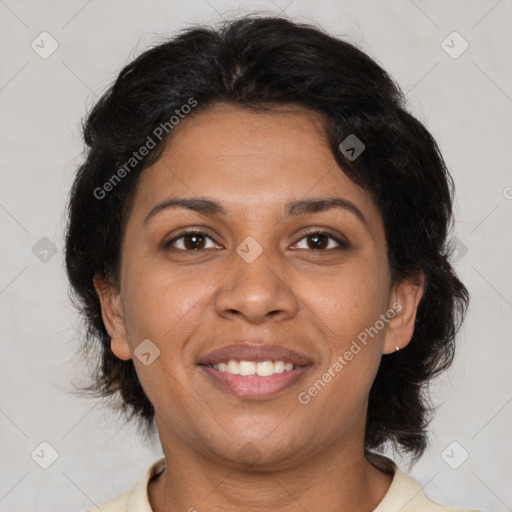 Joyful latino adult female with medium  brown hair and brown eyes