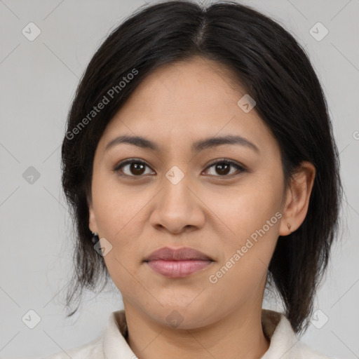 Joyful latino young-adult female with medium  brown hair and brown eyes