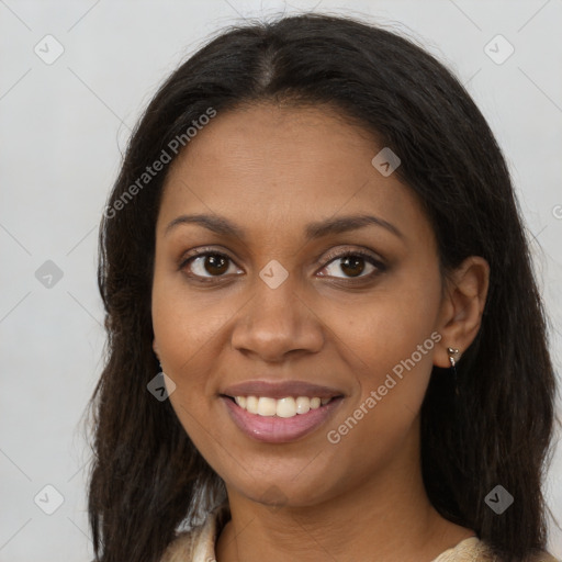 Joyful black young-adult female with long  brown hair and brown eyes