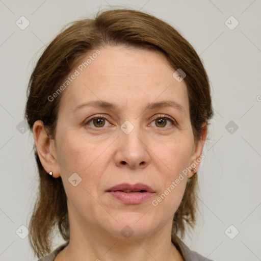 Joyful white adult female with medium  brown hair and grey eyes