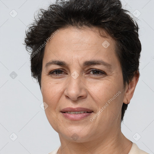 Joyful white adult female with short  brown hair and brown eyes