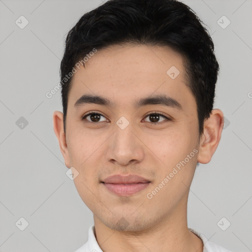 Joyful asian young-adult male with short  brown hair and brown eyes