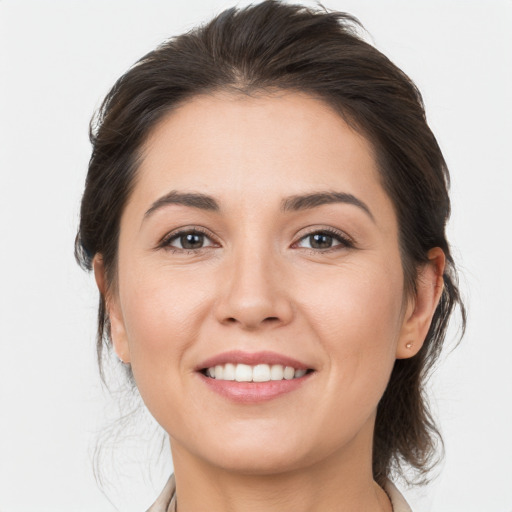 Joyful white young-adult female with medium  brown hair and brown eyes