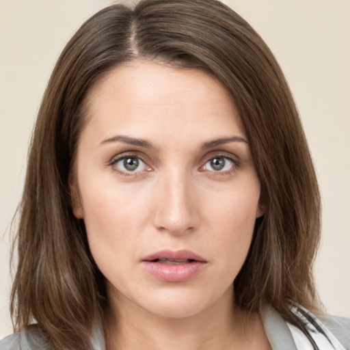 Neutral white young-adult female with medium  brown hair and brown eyes