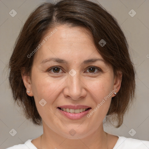 Joyful white adult female with medium  brown hair and brown eyes