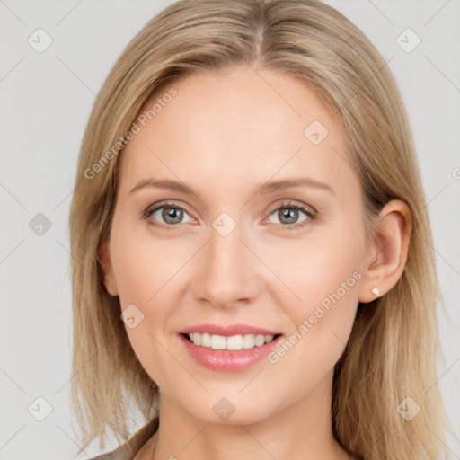 Joyful white young-adult female with long  brown hair and blue eyes