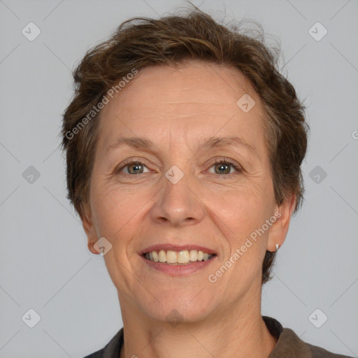 Joyful white adult female with short  brown hair and brown eyes