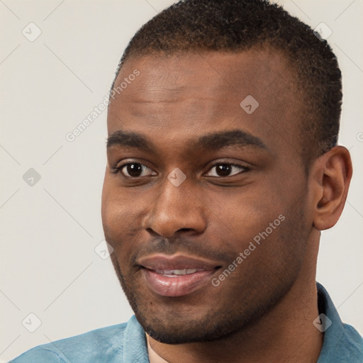 Joyful black young-adult male with short  brown hair and brown eyes