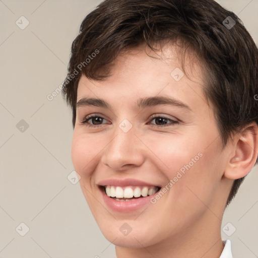 Joyful white young-adult female with short  brown hair and brown eyes