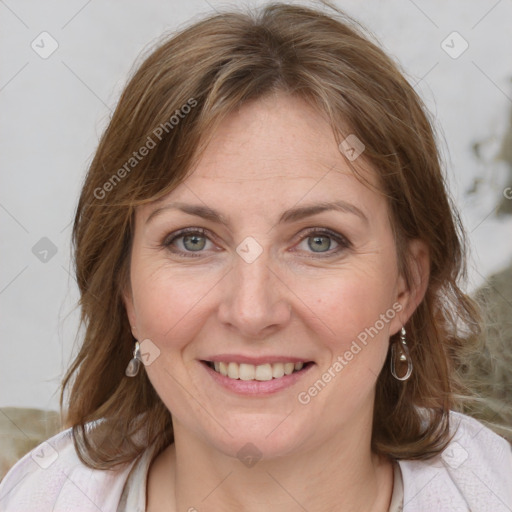 Joyful white adult female with medium  brown hair and blue eyes