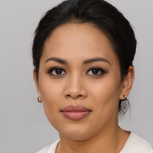 Joyful asian young-adult female with medium  black hair and brown eyes