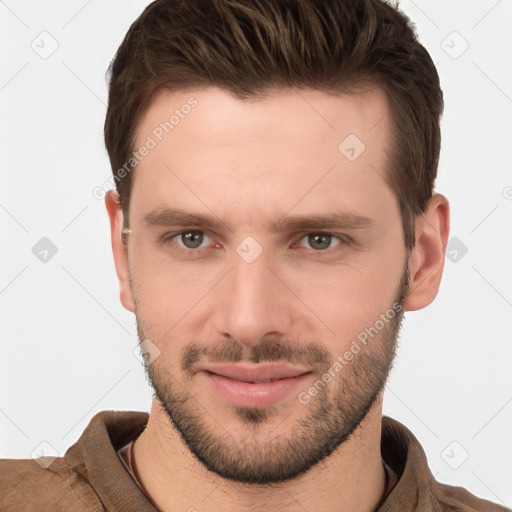 Joyful white young-adult male with short  brown hair and brown eyes