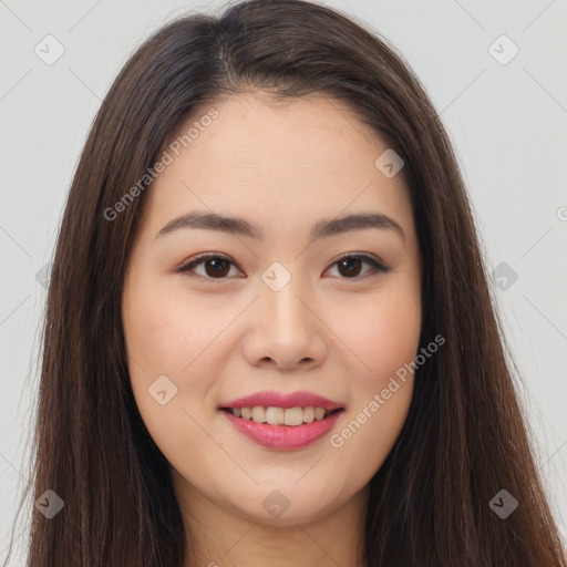 Joyful asian young-adult female with long  brown hair and brown eyes