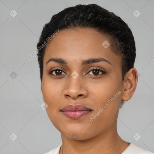 Joyful black young-adult female with short  black hair and brown eyes