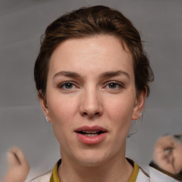 Joyful white young-adult female with medium  brown hair and brown eyes