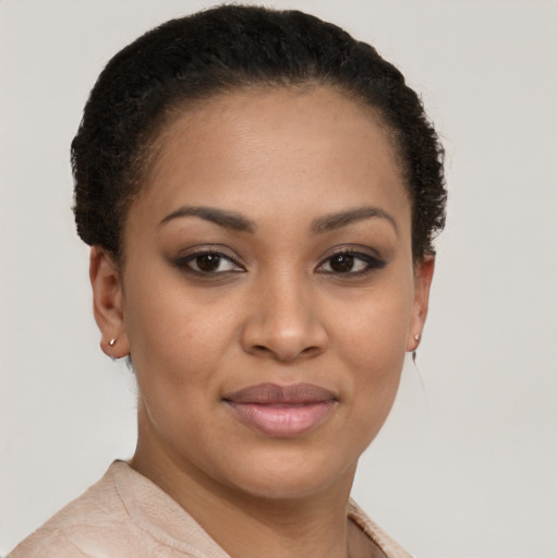 Joyful latino young-adult female with short  brown hair and brown eyes