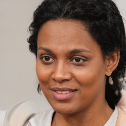 Joyful black young-adult female with medium  brown hair and brown eyes