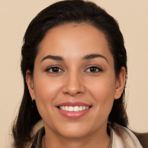 Joyful white young-adult female with long  brown hair and brown eyes