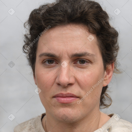 Joyful white adult female with short  brown hair and grey eyes