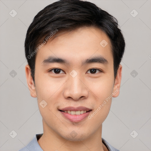 Joyful asian young-adult male with short  black hair and brown eyes