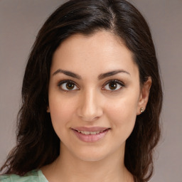 Joyful white young-adult female with medium  brown hair and brown eyes