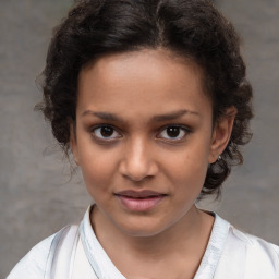 Joyful white child female with short  brown hair and brown eyes