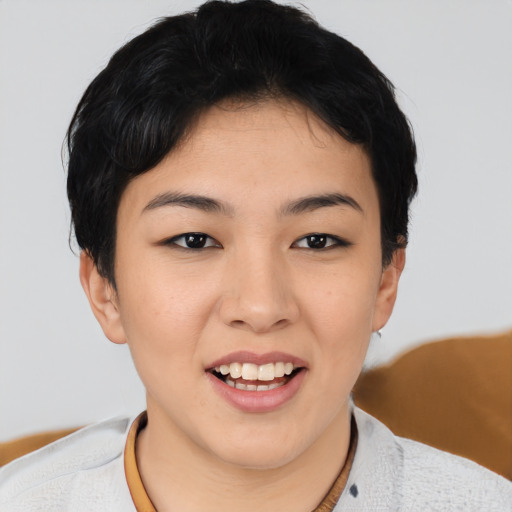 Joyful asian young-adult female with short  black hair and brown eyes
